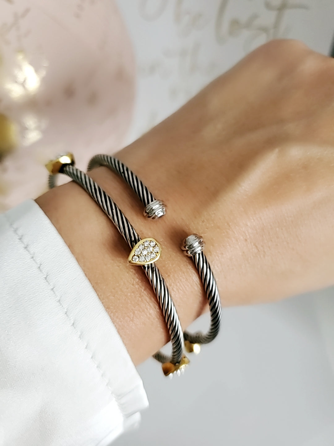 Wide Cable Bangle with Drop Accents featuring stainless steel and gold-filled materials, showcasing a modern design with elegant drop accents.