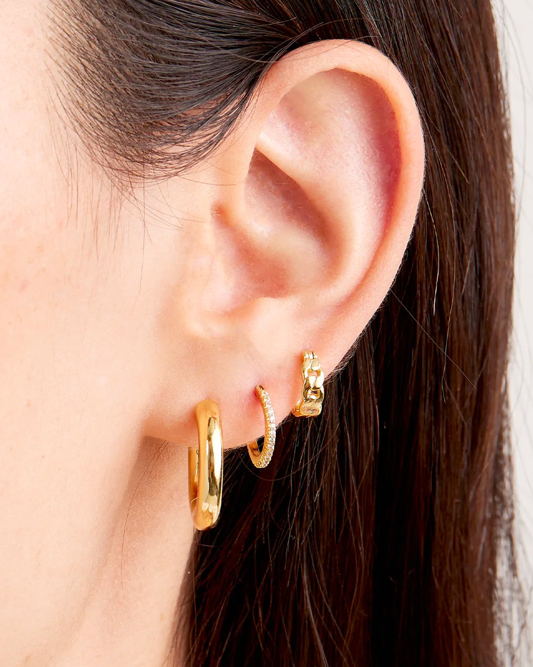 Wild Side Huggie Set featuring elegant gold-plated earrings designed for stacking and layering.