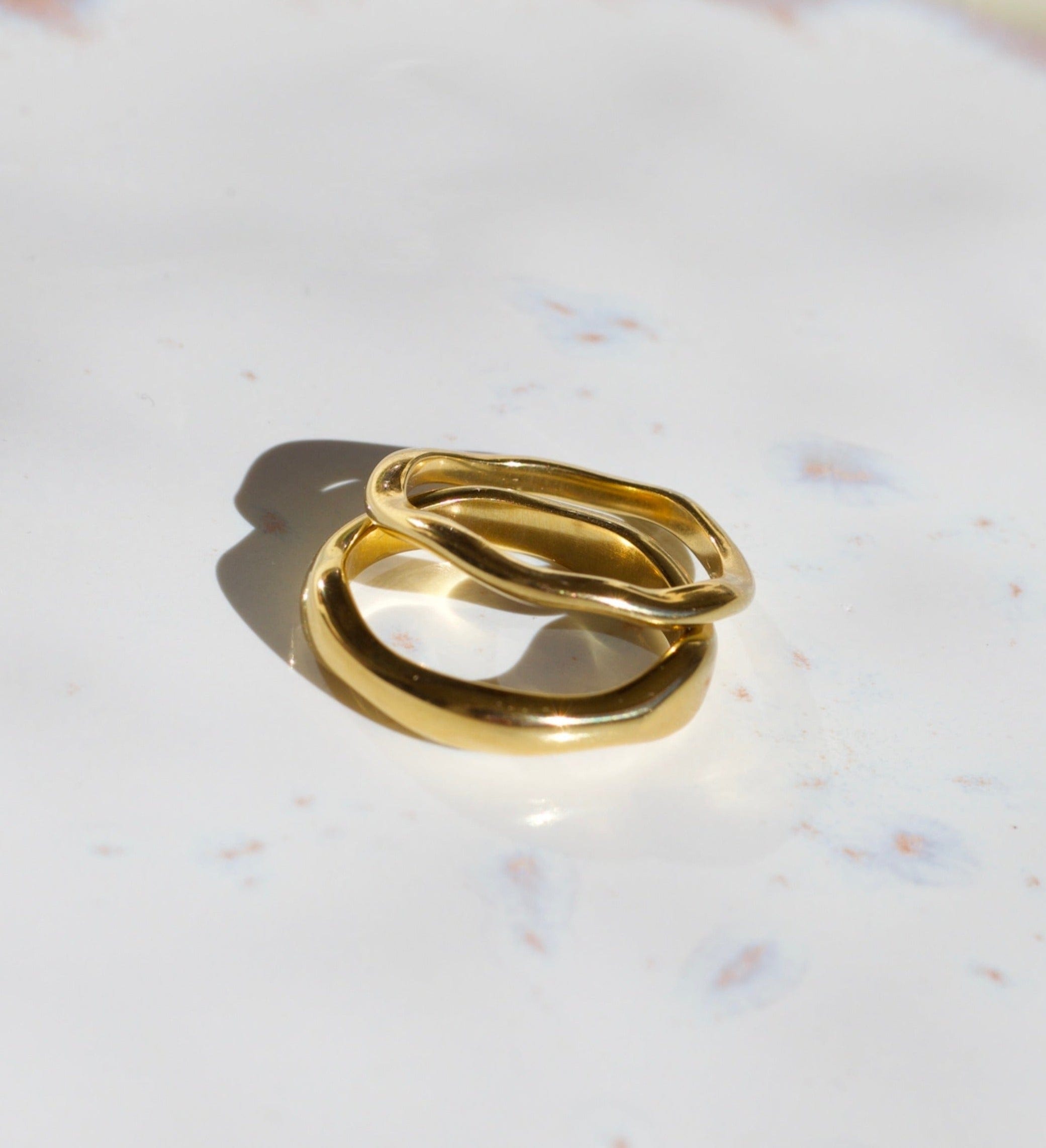 Elegant Winter Double Ring Gold made of titanium steel with 18k gold plating, showcasing a unique double ring design.