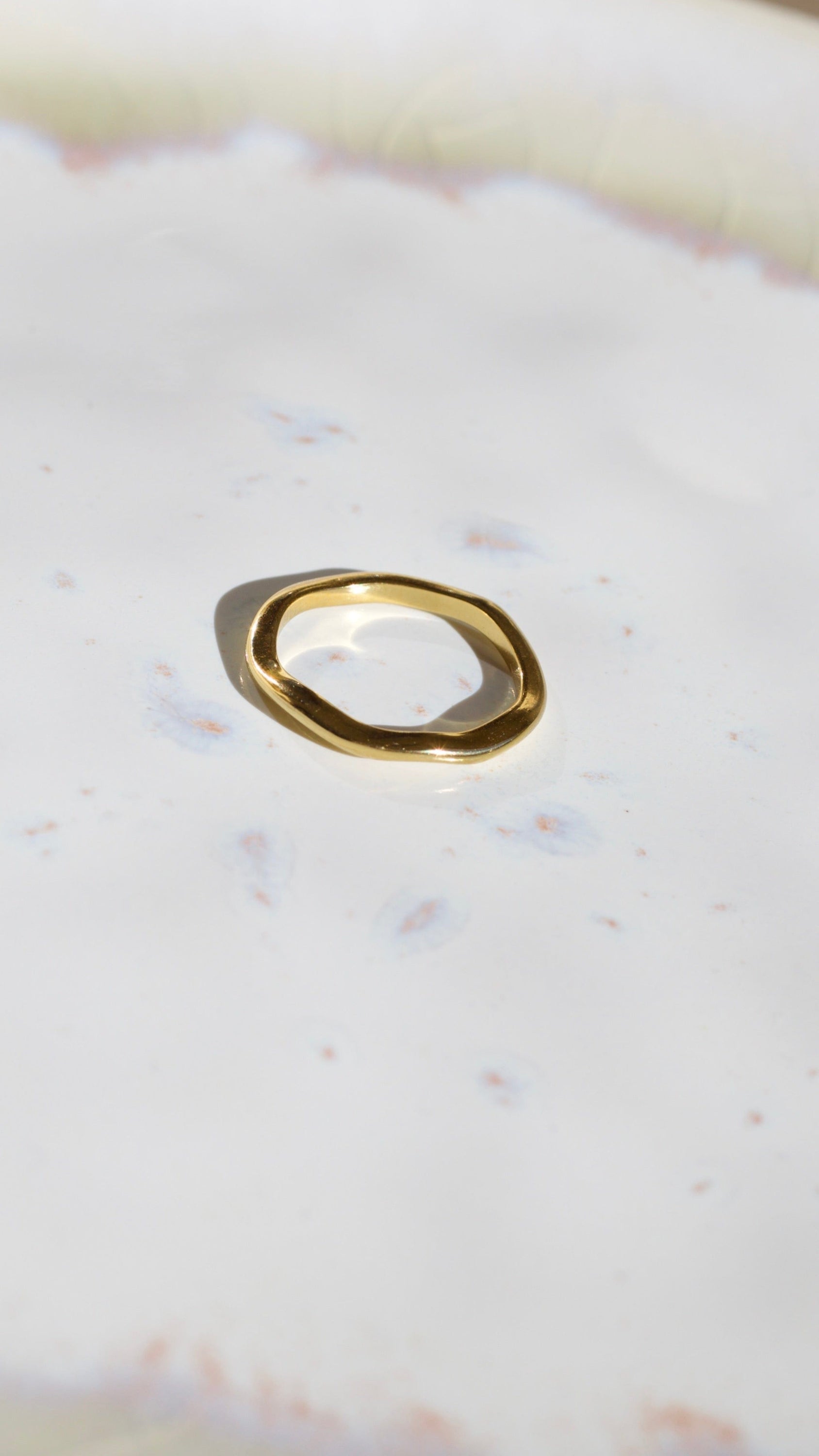 Elegant Winter Double Ring Gold made of titanium steel with 18k gold plating, showcasing a unique double ring design.