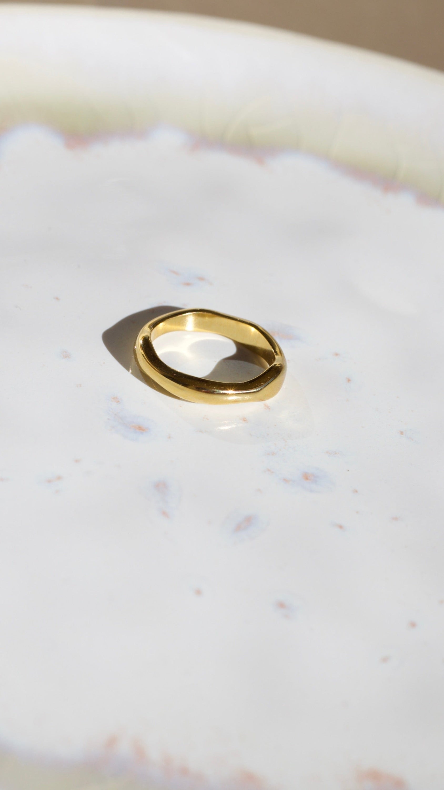 Elegant Winter Double Ring Gold made of titanium steel with 18k gold plating, showcasing a unique double ring design.