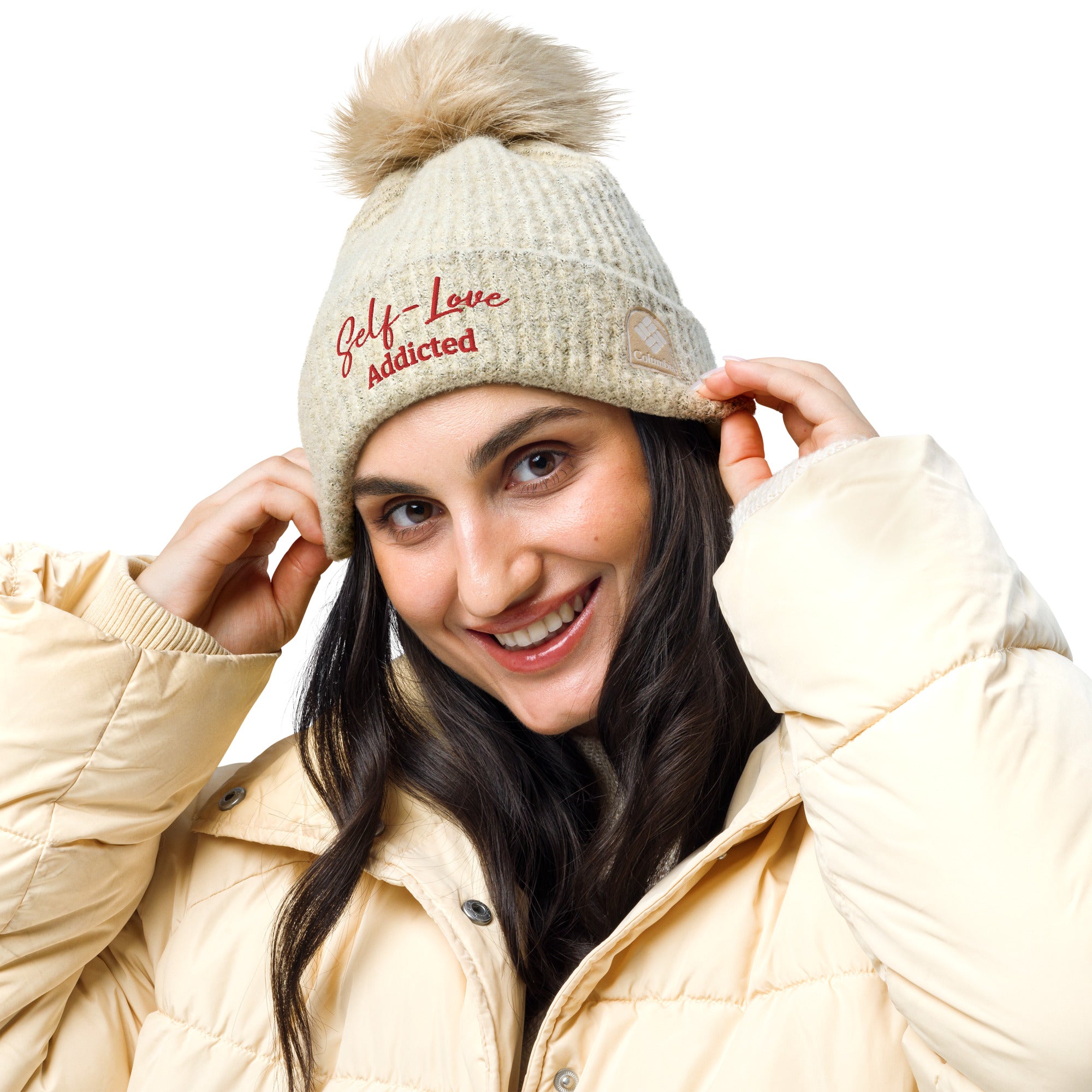 Cozy Columbia pom-pom beanie in winter, featuring fluffy pom on top and soft microfleece lining.