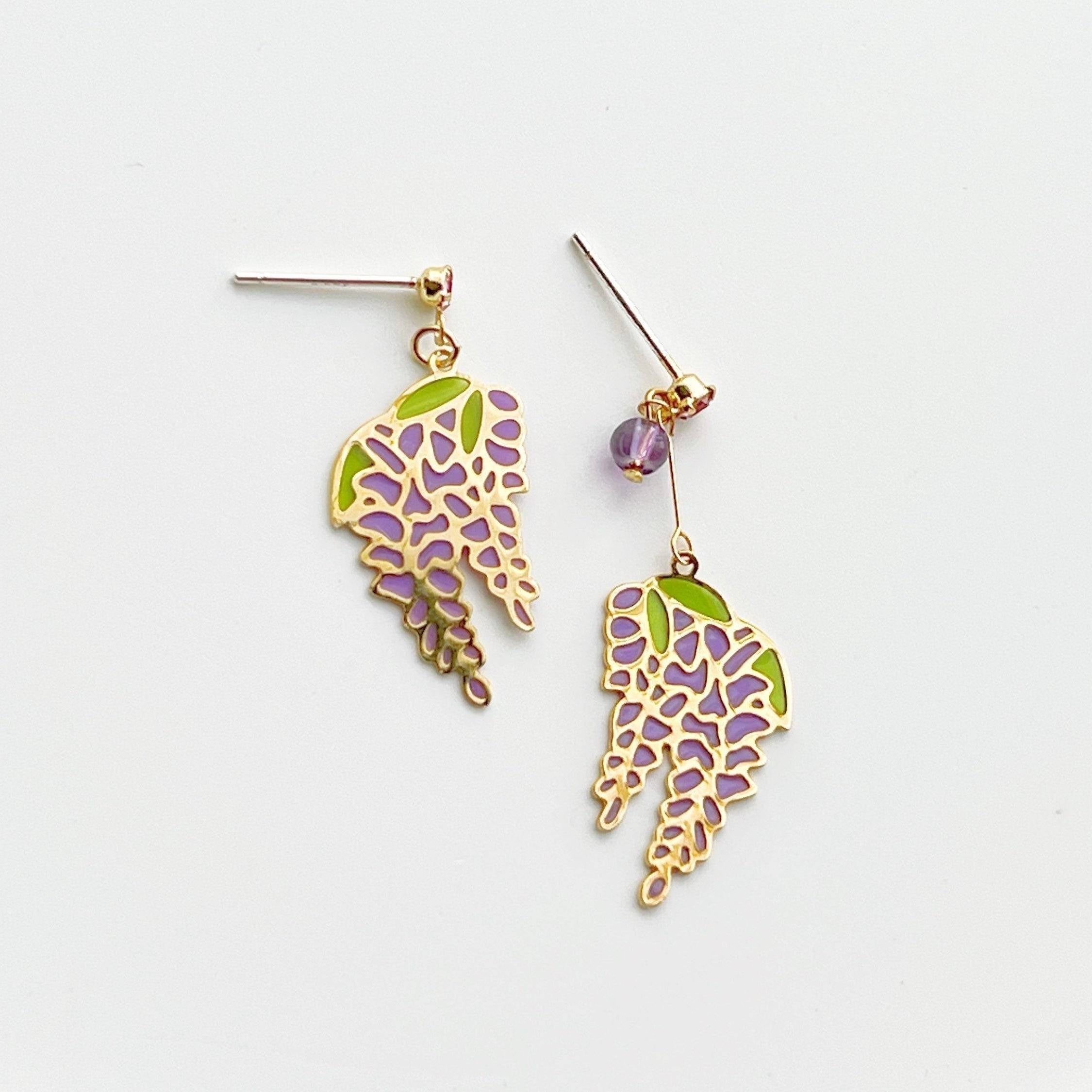 Wisteria Earrings featuring purple flowers and leaves, crafted from sterling silver, gold plated bronze, and resin.