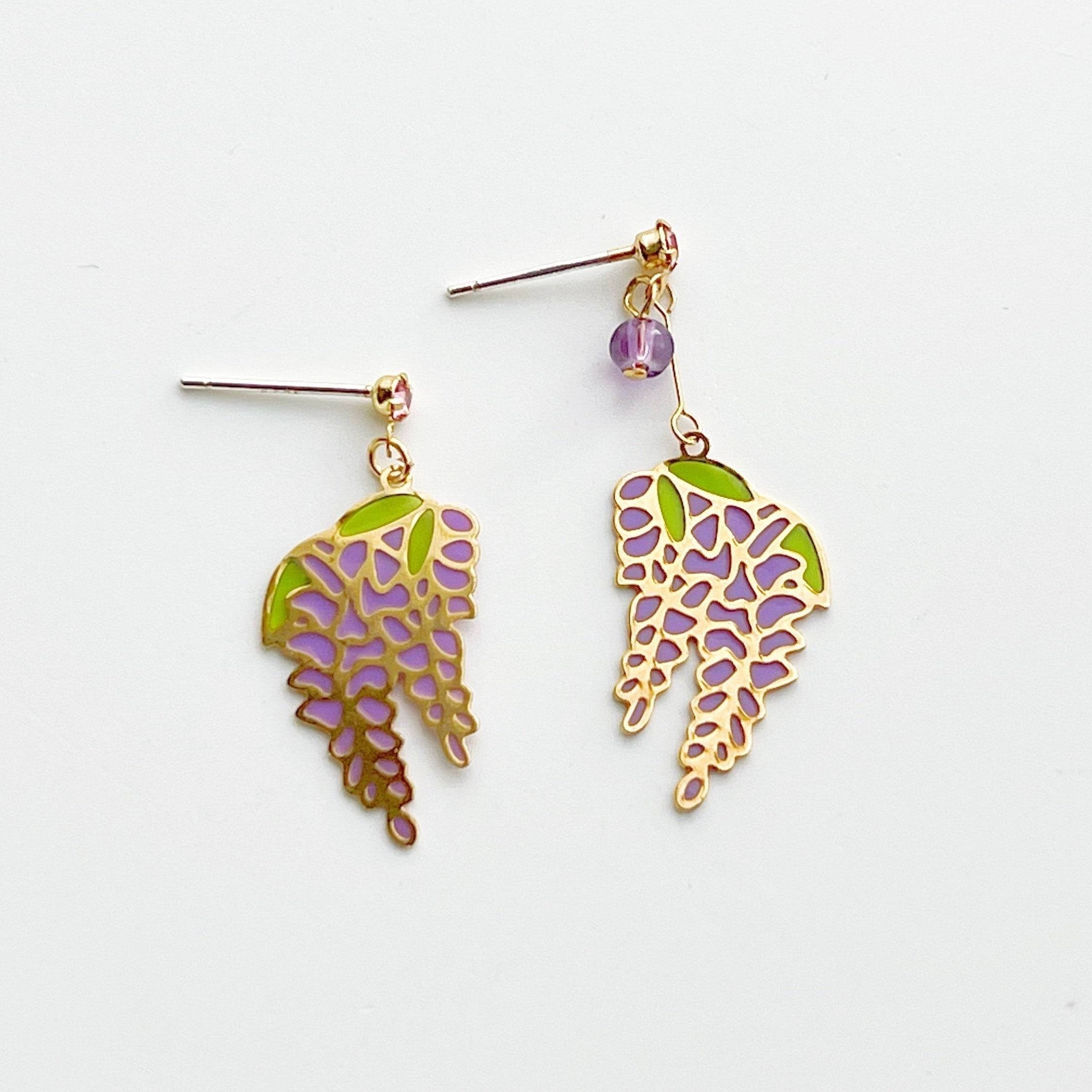 Wisteria Earrings featuring purple flowers and leaves, crafted from sterling silver, gold plated bronze, and resin.