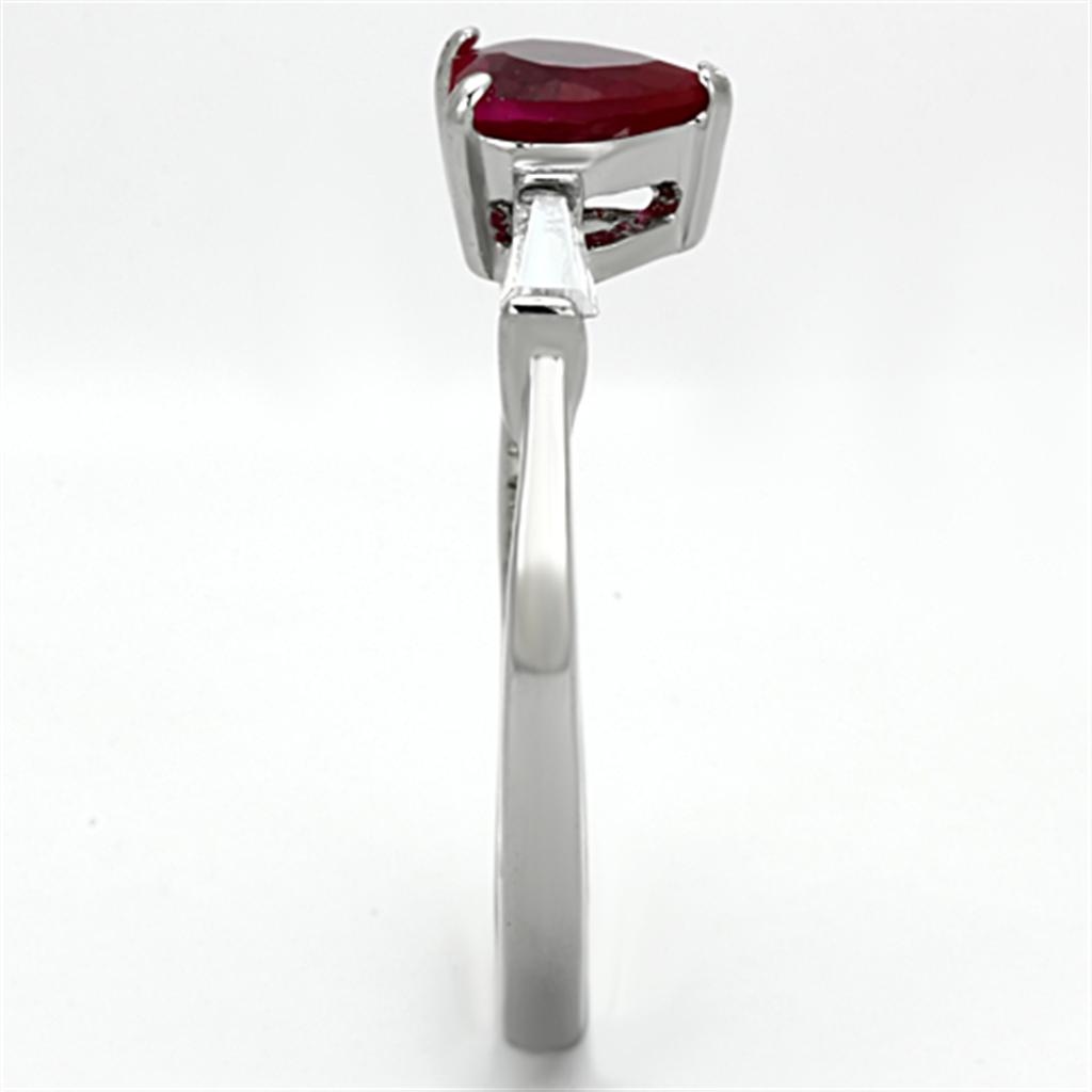 Elegant women's stainless steel ring with cubic zirconia and ruby accent, showcasing a high-polished finish.
