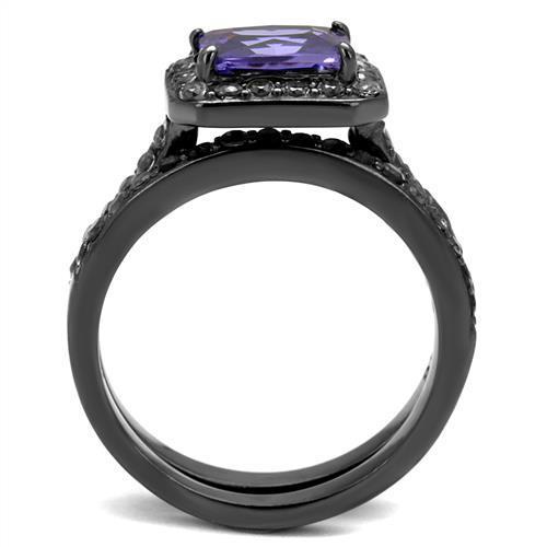 Elegant women’s stainless steel ring with cubic zirconia and tanzanite accents, featuring an IP light black finish.