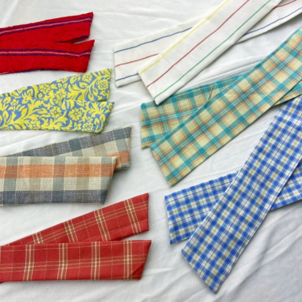 Yellow Smiley Cloth Changeable Cotton wristwatch with a breathable strap and playful smiley prints, featuring a unique tying closure.