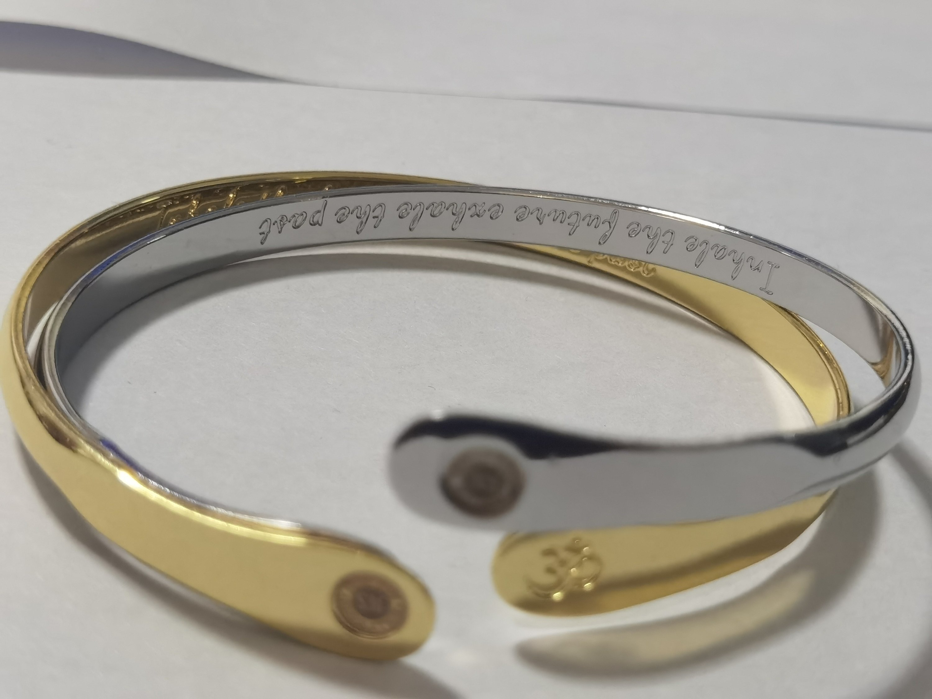 Elegant Yoga Bracelet featuring the Om symbol and engraved quote 'Inhale the future, exhale the past', white gold plated, adjustable cuff design.