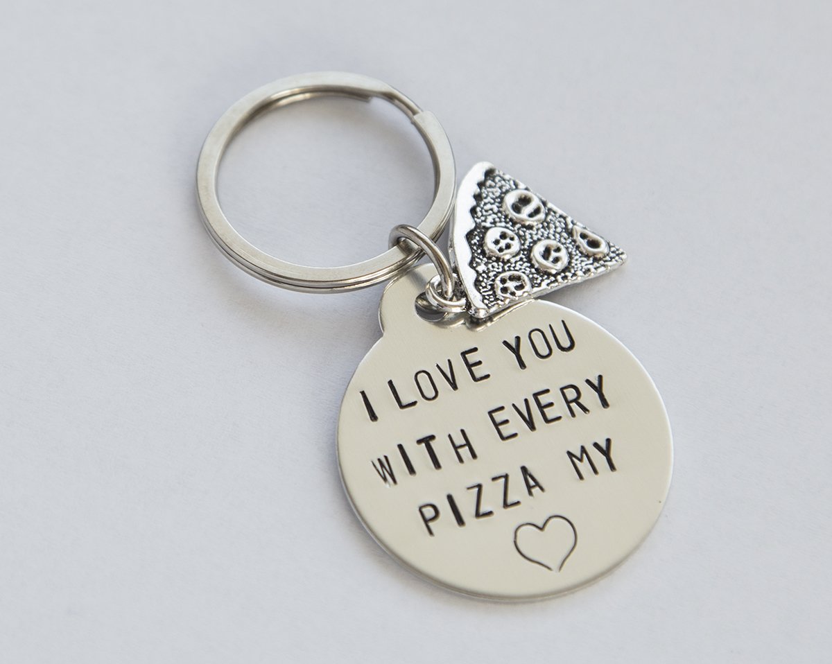 A hand-stamped stainless steel keychain with a round charm saying 'You have a pizza my heart', perfect for pizza lovers.