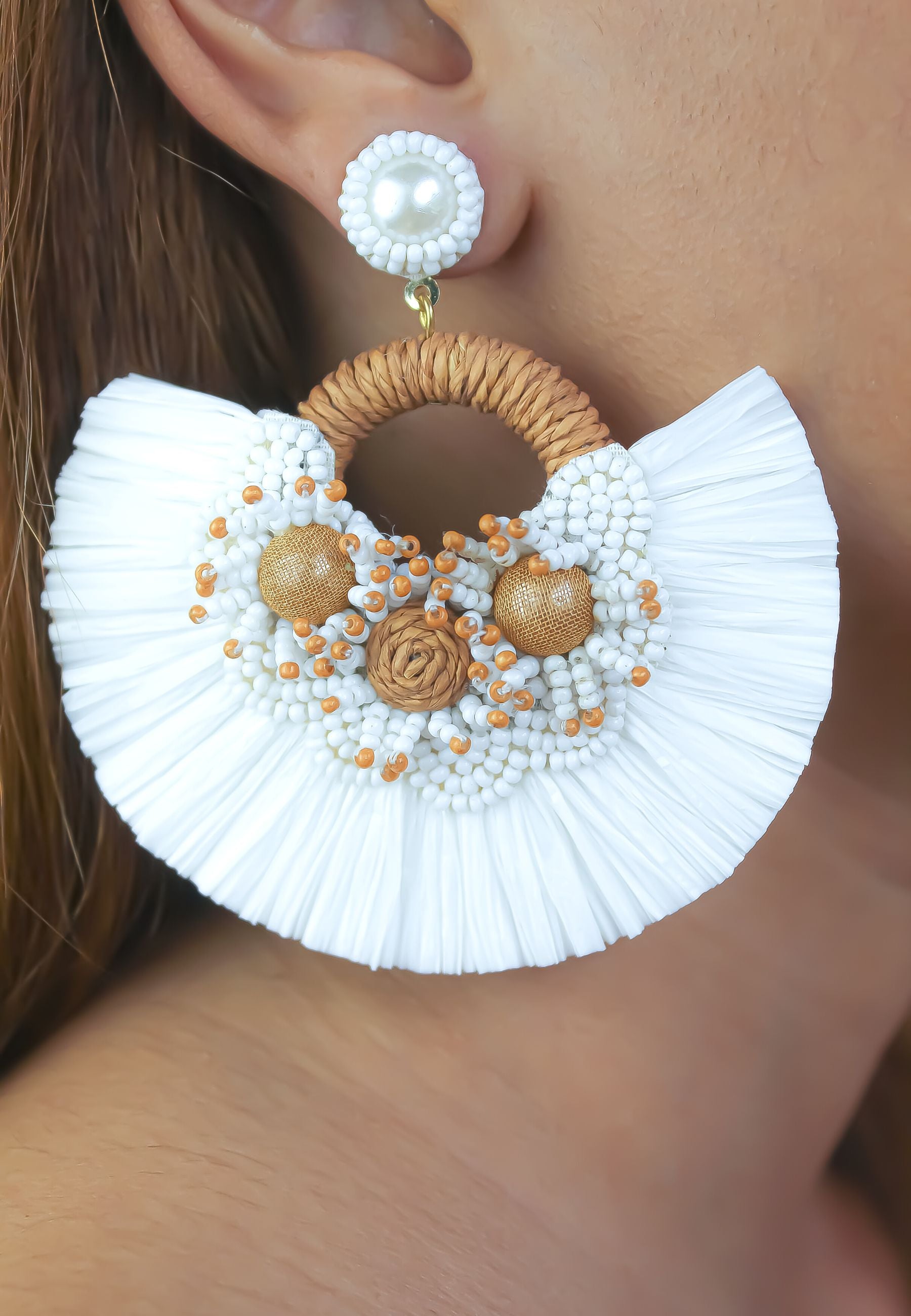 Vibrant Zanzibar Earrings handmade from white bronze, showcasing intricate designs inspired by Tanzanian culture.