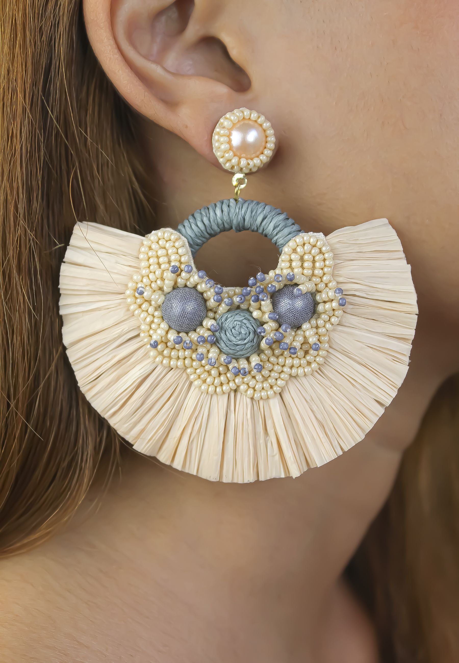 Vibrant Zanzibar Earrings handmade from white bronze, showcasing intricate designs inspired by Tanzanian culture.