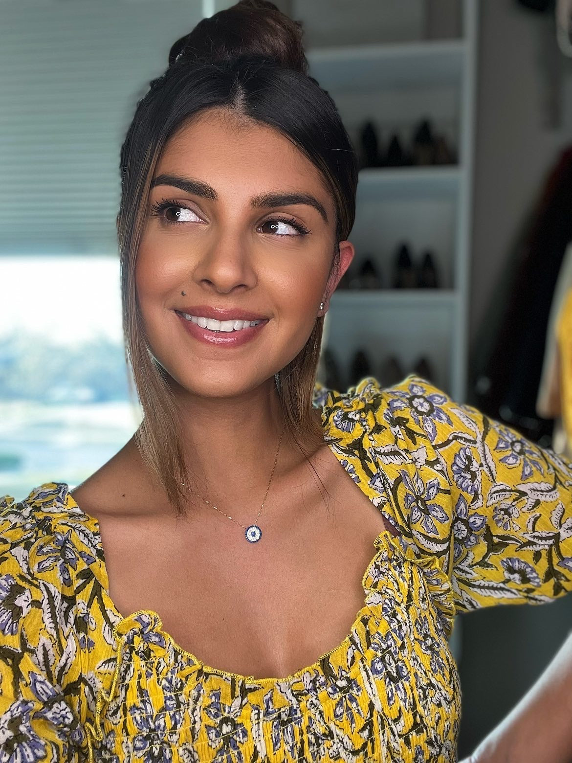 ZARIA Necklace featuring 925 sterling silver and cubic zirconia with yellow gold plating, elegantly displayed on a soft background.