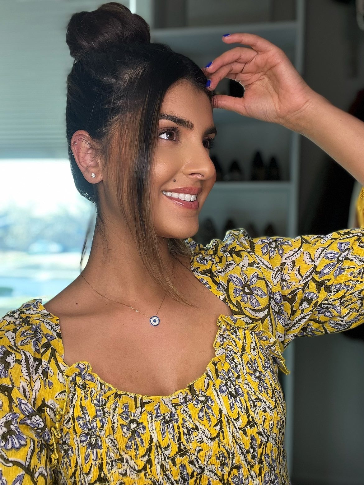 ZARIA Necklace featuring 925 sterling silver and cubic zirconia with yellow gold plating, elegantly displayed on a soft background.