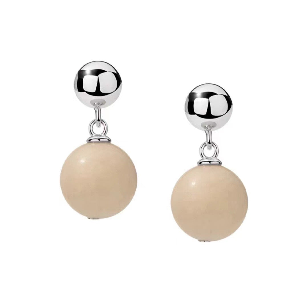 A beautiful Zen Harmony Tranquil White Fossil Necklace featuring natural white fossil stones, elegantly designed with 12mm beads.