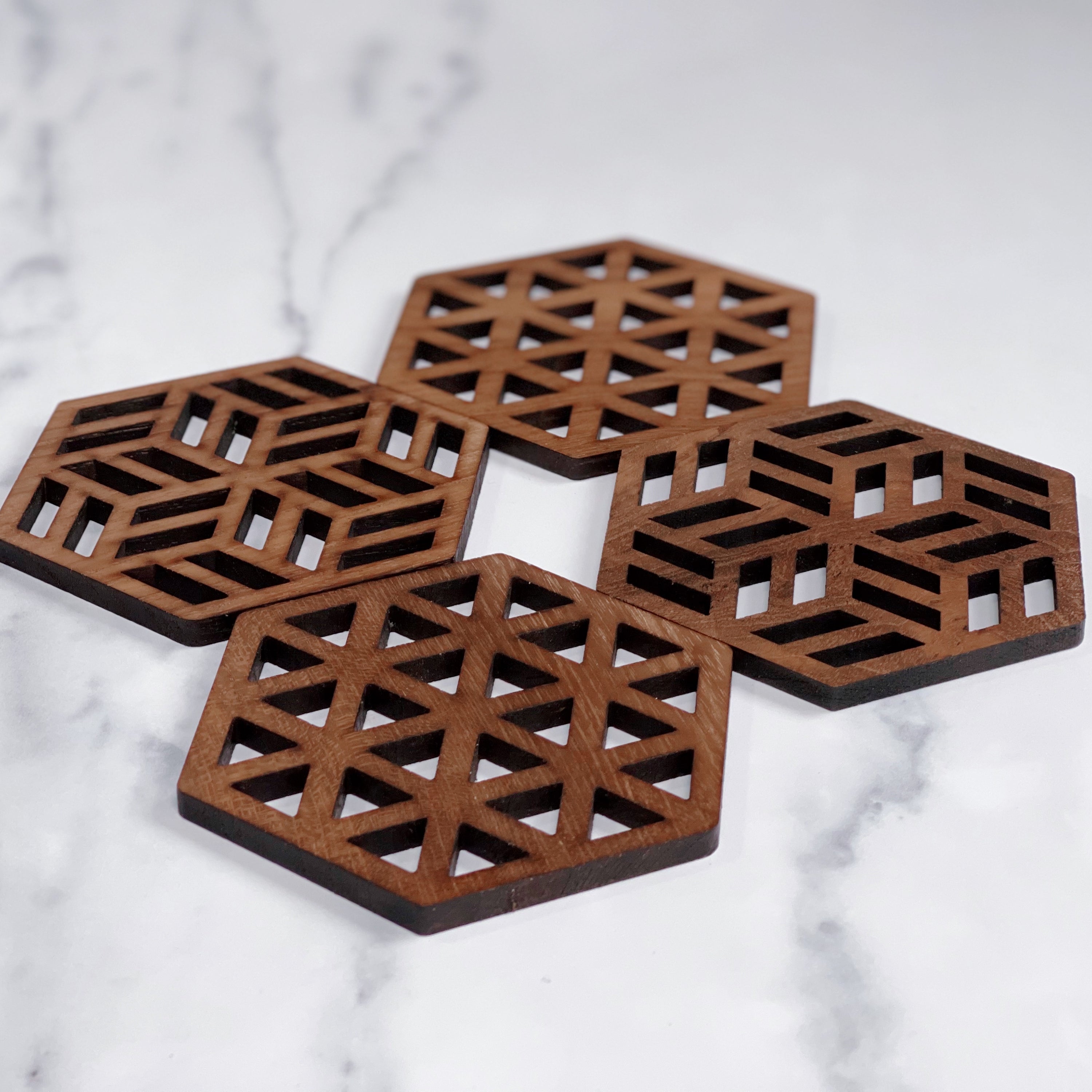 Set of Zeta Upcycled Teak Wood Coasters, showcasing unique grain patterns and smooth finish.