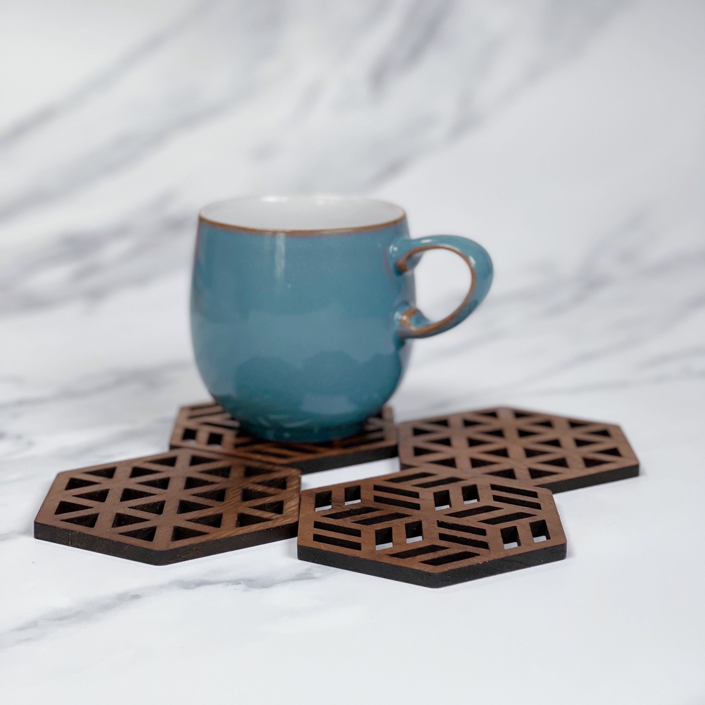 Set of Zeta Upcycled Teak Wood Coasters, showcasing unique grain patterns and smooth finish.