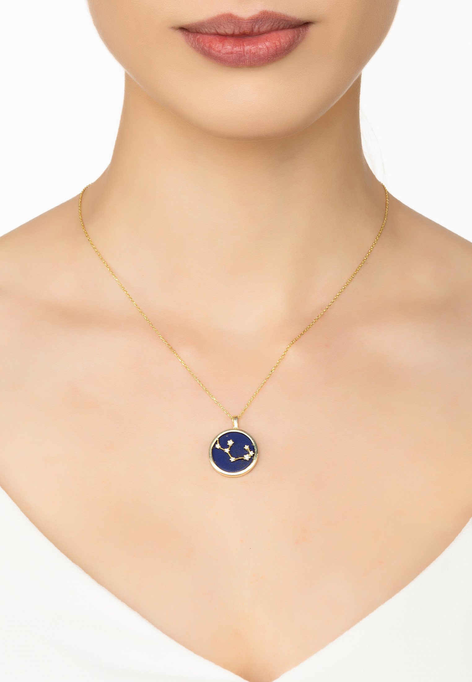 Zodiac Lapis Lazuli Gemstone Star Constellation Pendant Necklace in gold, featuring a deep blue lapis lazuli stone and sparkling cubic zirconia.