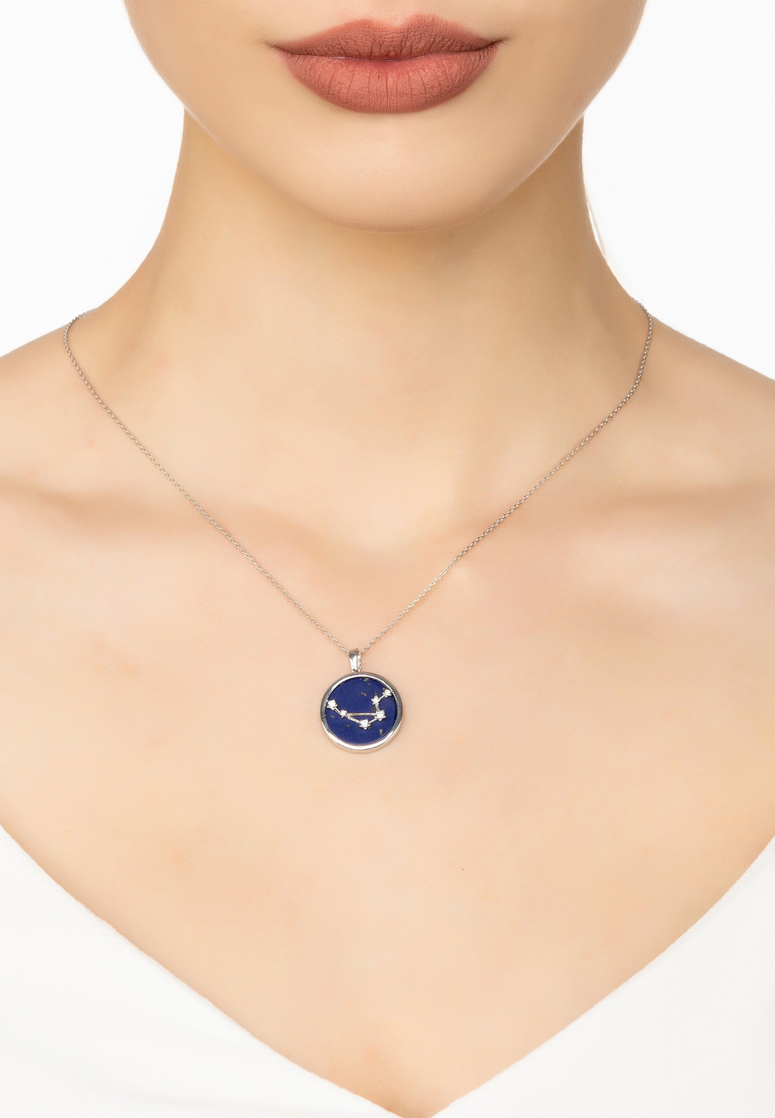 Zodiac Lapis Lazuli Gemstone Star Constellation Pendant Necklace featuring a deep blue lapis lazuli disc and sparkling cubic zirconia stars.