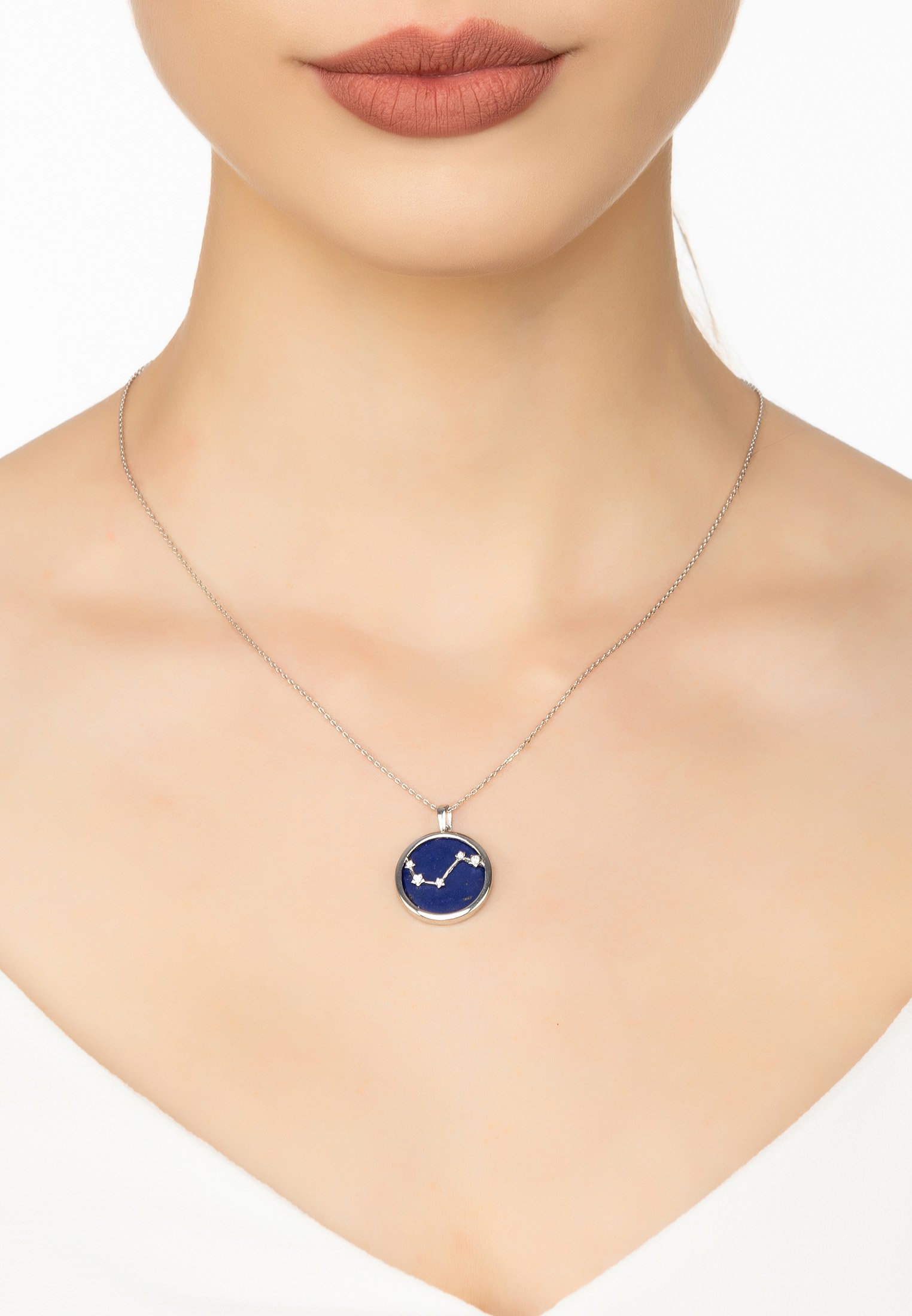 Zodiac Lapis Lazuli Gemstone Star Constellation Pendant Necklace featuring a dark blue lapis lazuli stone and sparkling cubic zirconia in sterling silver.
