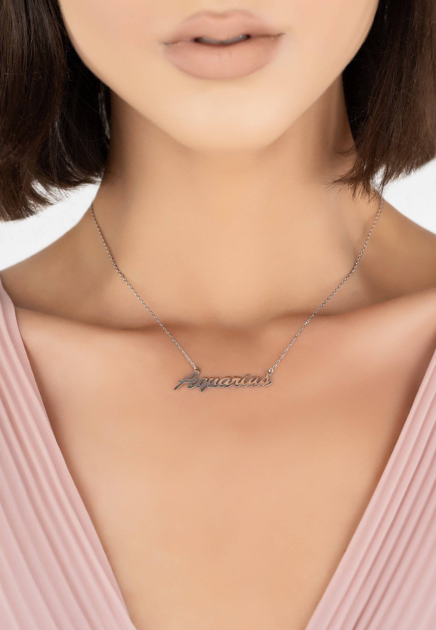 Silver Zodiac Star Sign Name Necklace featuring the Aquarius symbol, elegantly designed for stylish layering.