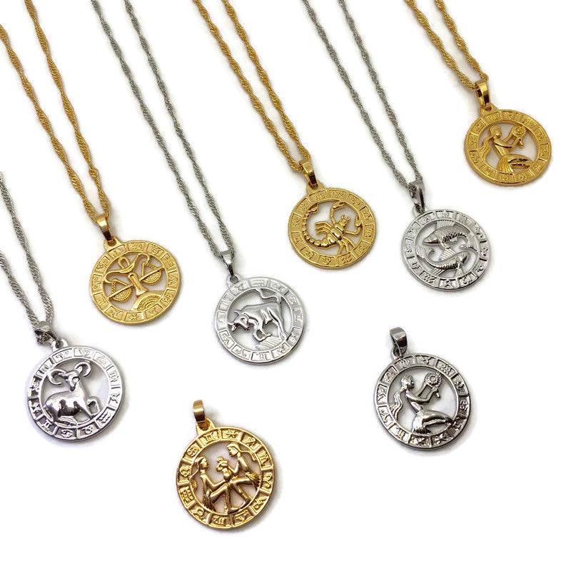 Zodiac Symbol Coin Necklace featuring a gold plated stainless steel pendant with astrological symbols, displayed on a delicate chain.