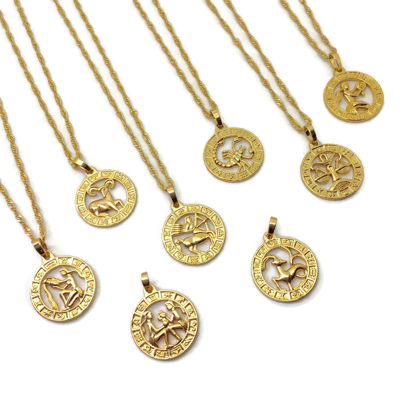 Zodiac Symbol Coin Necklace featuring a gold plated stainless steel pendant with astrological symbols, displayed on a delicate chain.