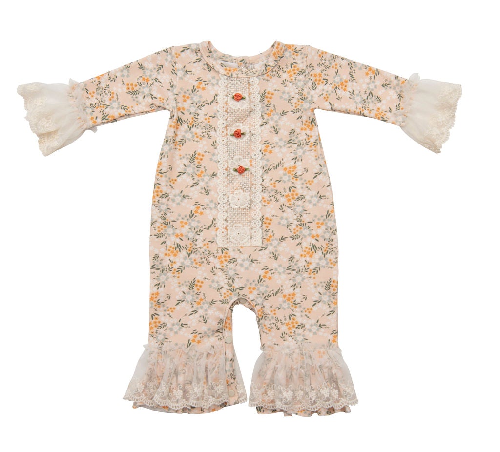 Avas Garden Romper featuring pastel orange fabric and intricate lace detailing, perfect for summer outings.