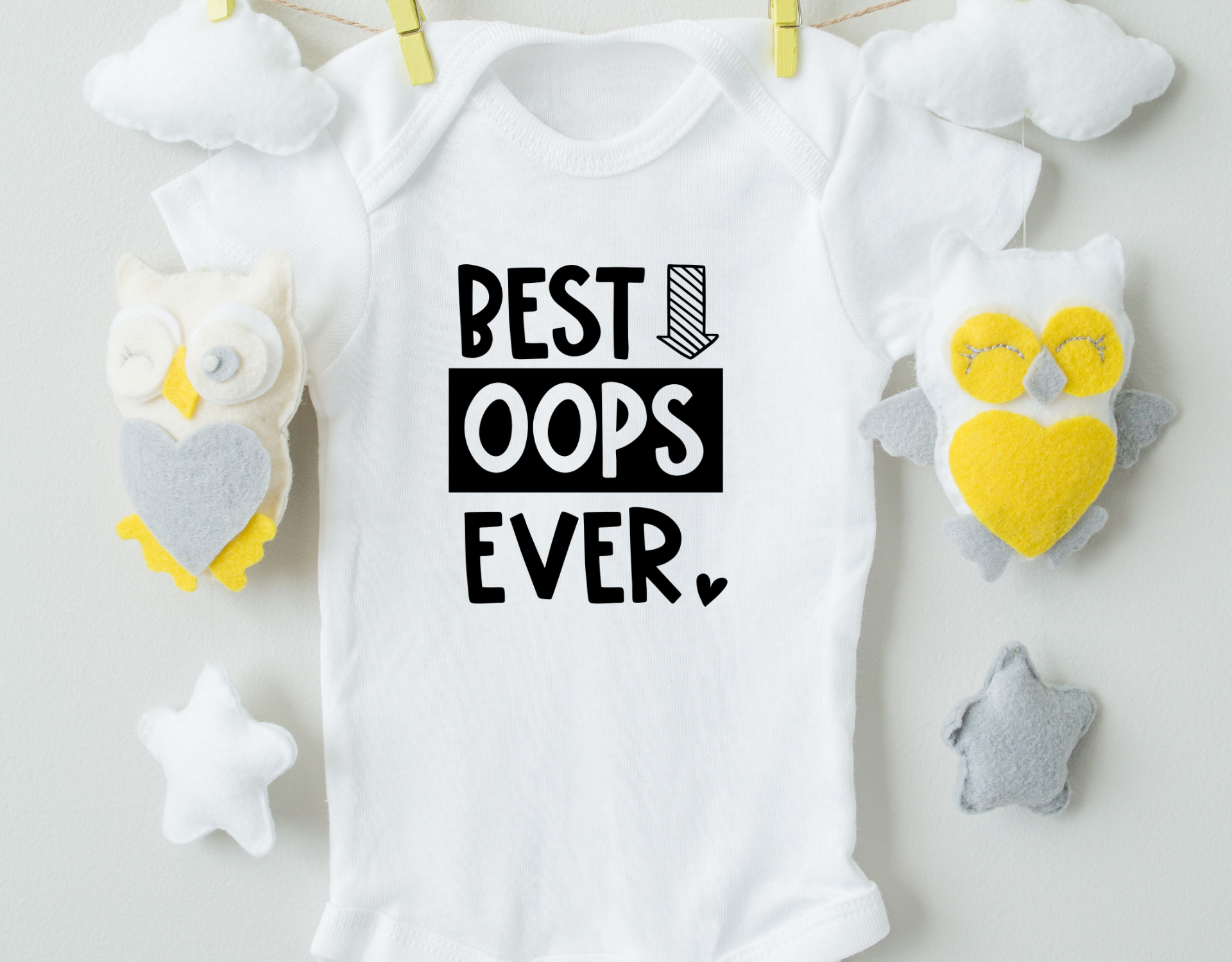 Best Oops Ever Cotton Baby Bodysuit in white with a playful design, featuring an expandable neckline and snap closure for easy dressing.