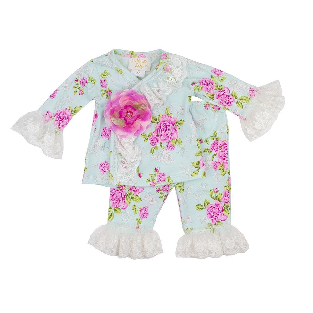 Bloomsbury Infant Girls Criss Cross Set featuring soft cotton fabric, a charming crisscross design, matching cap, and blanket in vibrant multi-color.