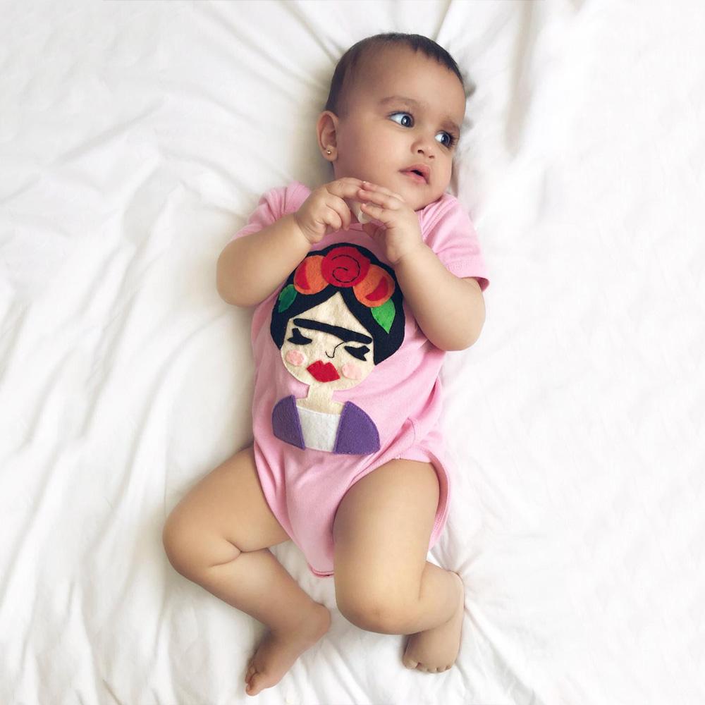 Gray and pink Frida Infant Bodysuit with felt appliqués, handmade and designed for comfort and style.