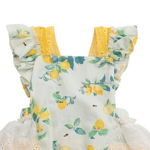 Lucy’s Lemonade Sunsuit featuring a vibrant lemon print, designed for children, perfect for summer outings.
