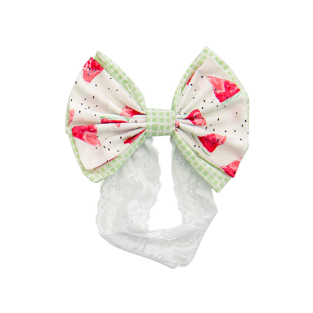 Mia's Melons Lucy Bow in vibrant colors, showcasing its stylish design and high-quality fabric.