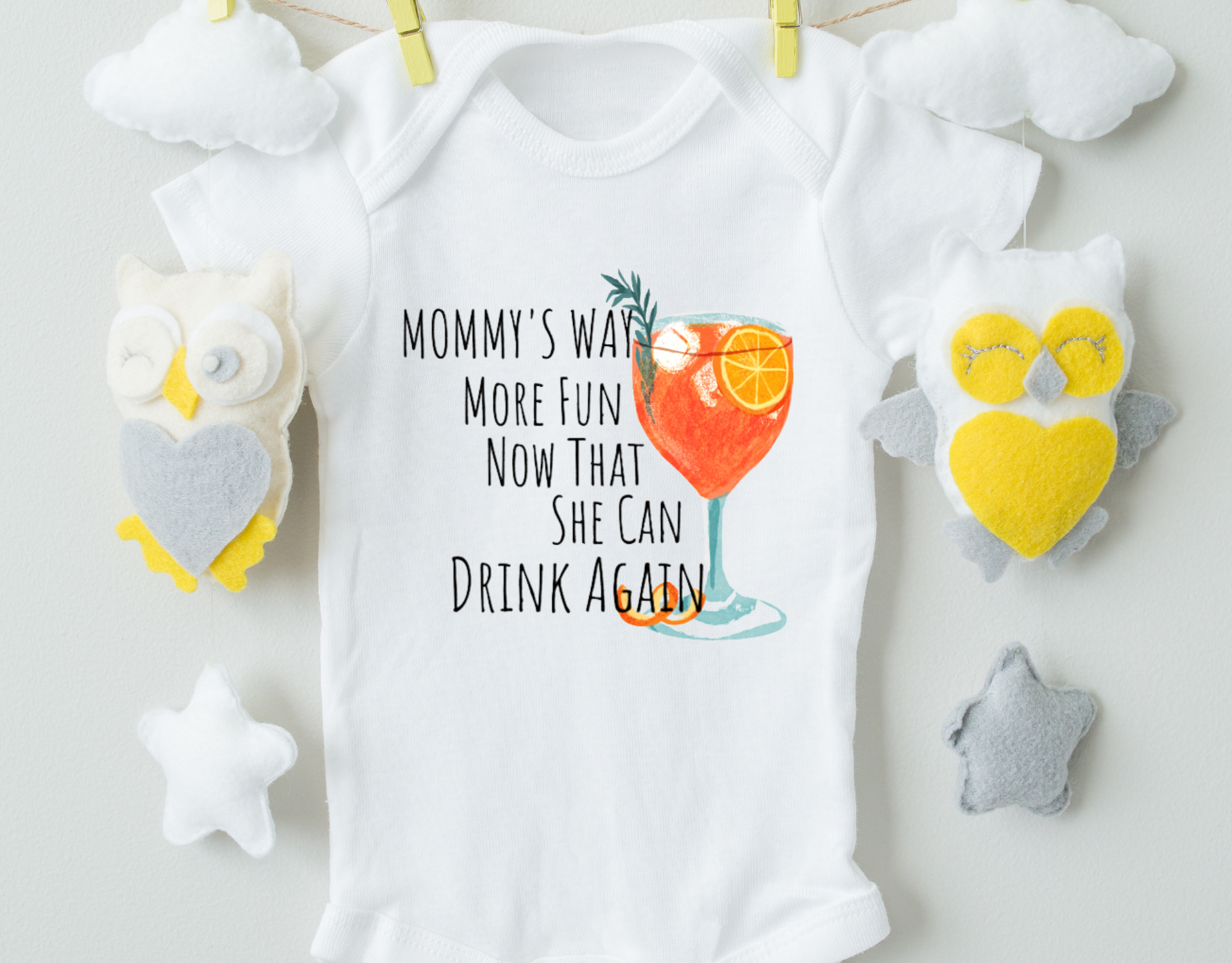 Mommy's Way More Fun Now That She Can Drink Again Bodysuit in white cotton with playful text design, featuring expandable neckline and snap closure.
