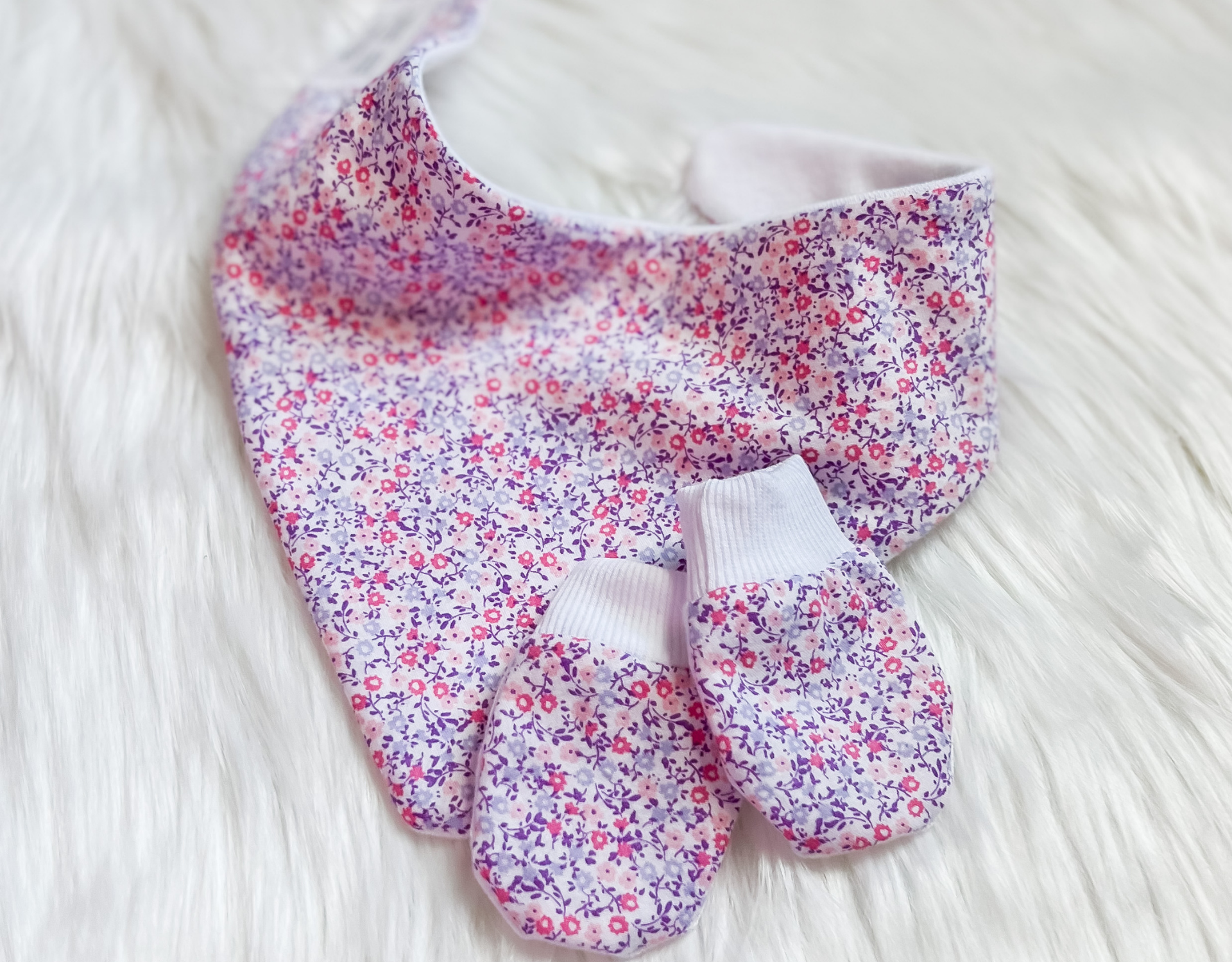 Purple floral bandana bib paired with no scratch hand mittens, designed for babies aged 3-24 months, showcasing a stylish and functional accessory set.