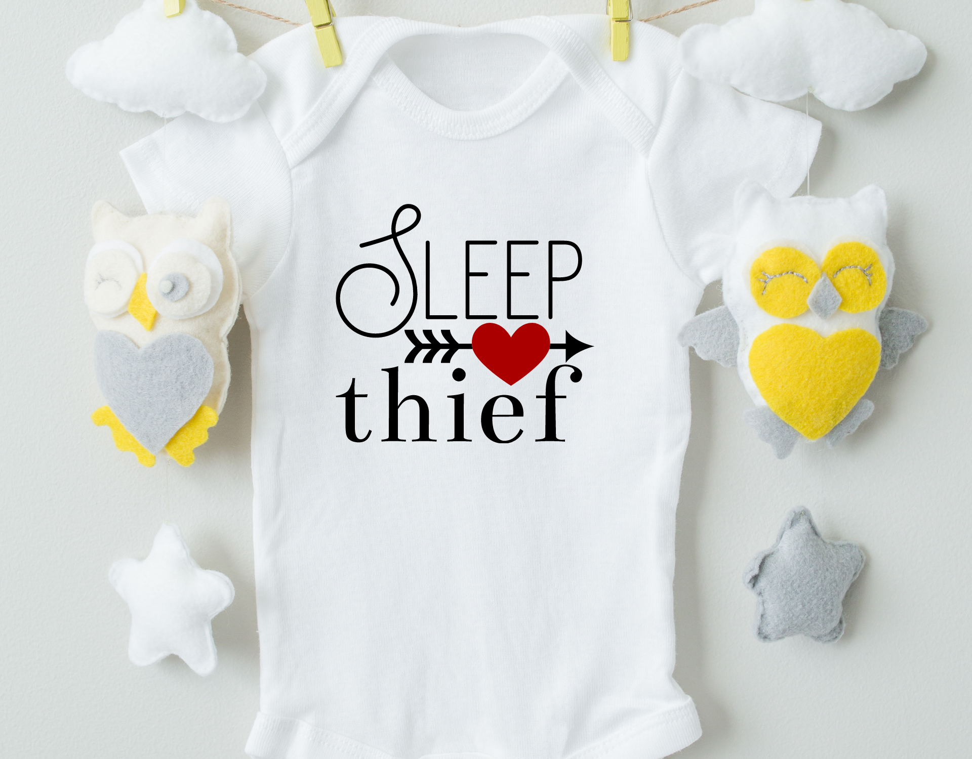 Sleep Thief Cotton Baby Bodysuit in soft cotton with expandable neckline and snap closure, perfect for infants.