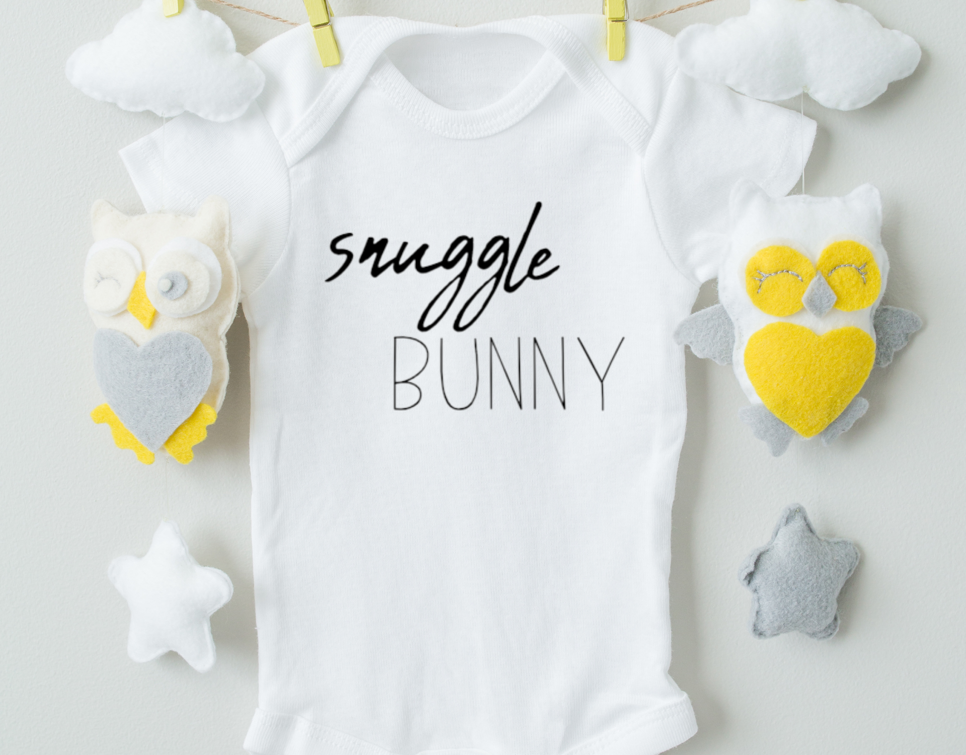 Snuggle Bunny Cotton Baby Bodysuit featuring a cute bunny design, made from soft 100% cotton with an expandable neckline and snap closure.