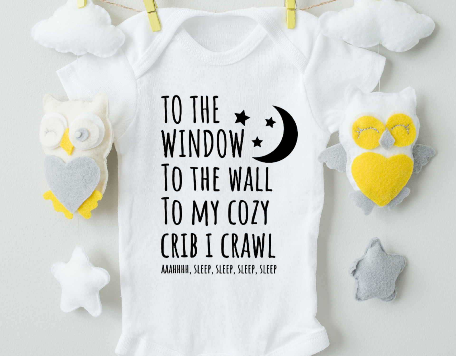 To The Window Bodysuit made of 100% cotton with a heat transfer vinyl design, featuring an expandable neckline and front snap closure.