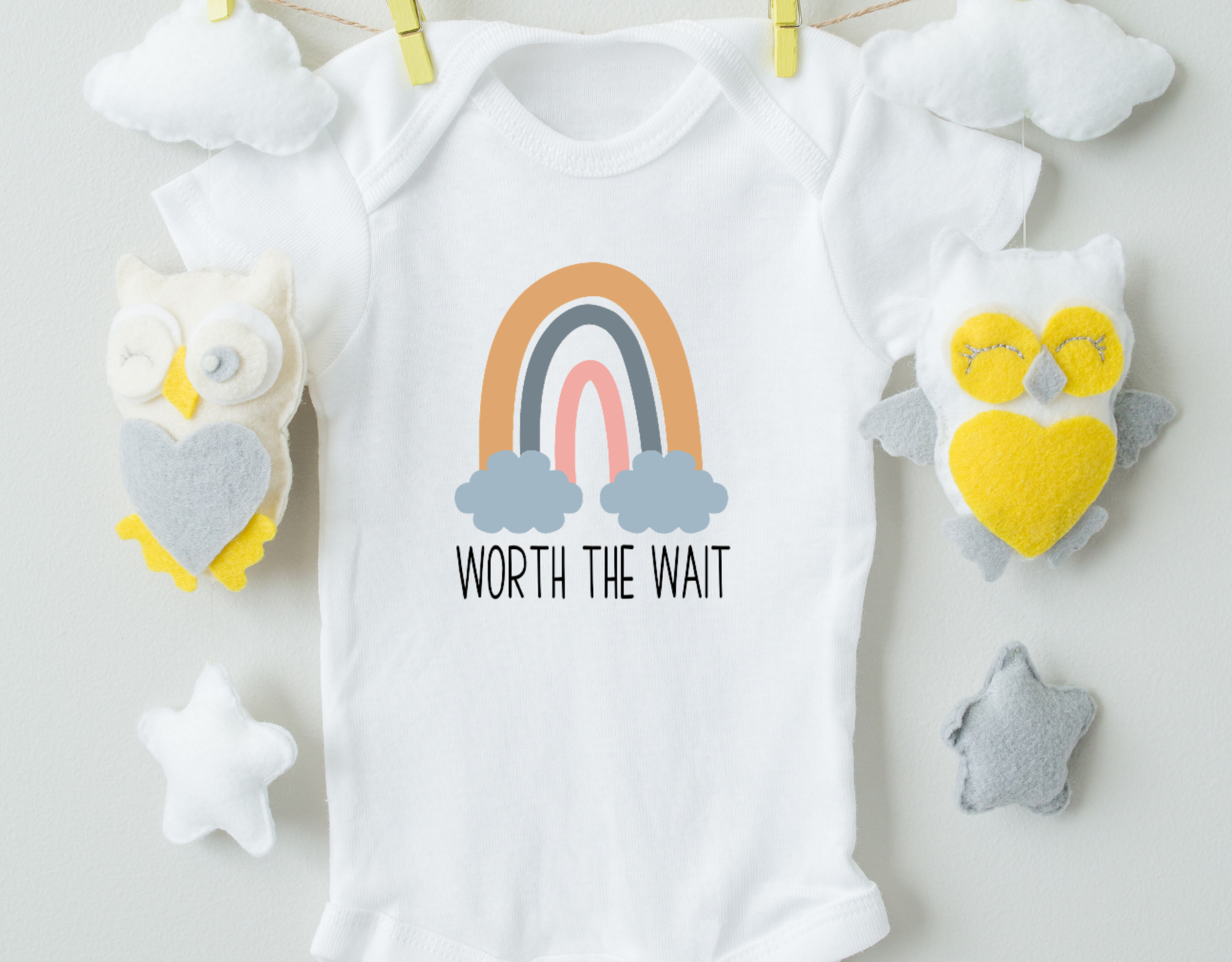 A soft, 100% cotton baby bodysuit with a professional heat transfer vinyl design, featuring an expandable neckline and snap closure.