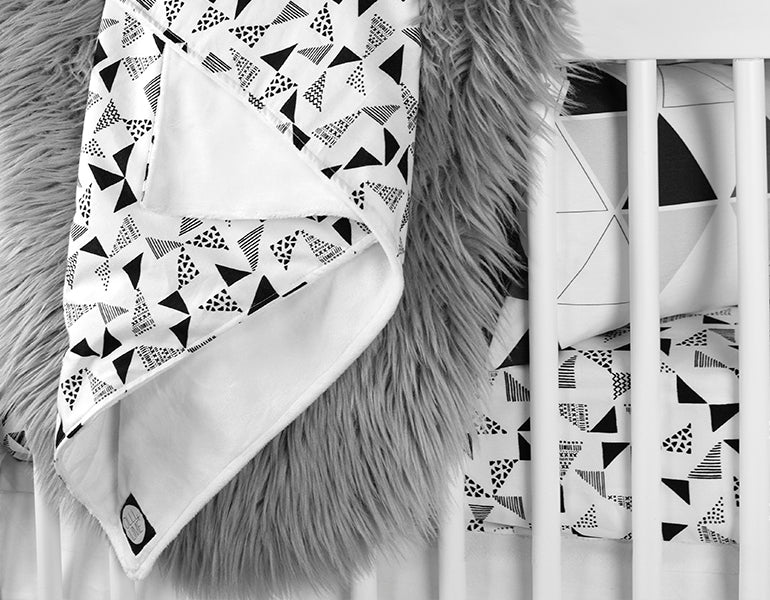 Felix & Marti Baby Blanket featuring a modern Multi-Triangle design in soft cotton and plush minky fabric, perfect for nurseries.