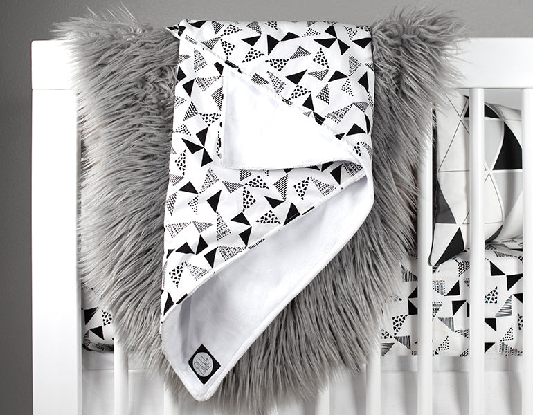 Felix & Marti Baby Blanket featuring a modern Multi-Triangle design in soft cotton and plush minky fabric, perfect for nurseries.