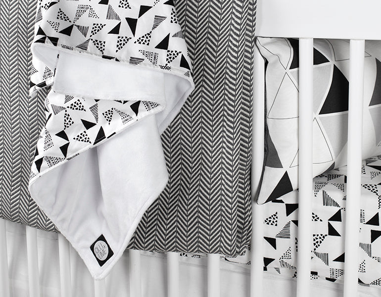 Felix & Marti Baby Blanket featuring a modern Multi-Triangle design in soft cotton and plush minky fabric, perfect for nurseries.