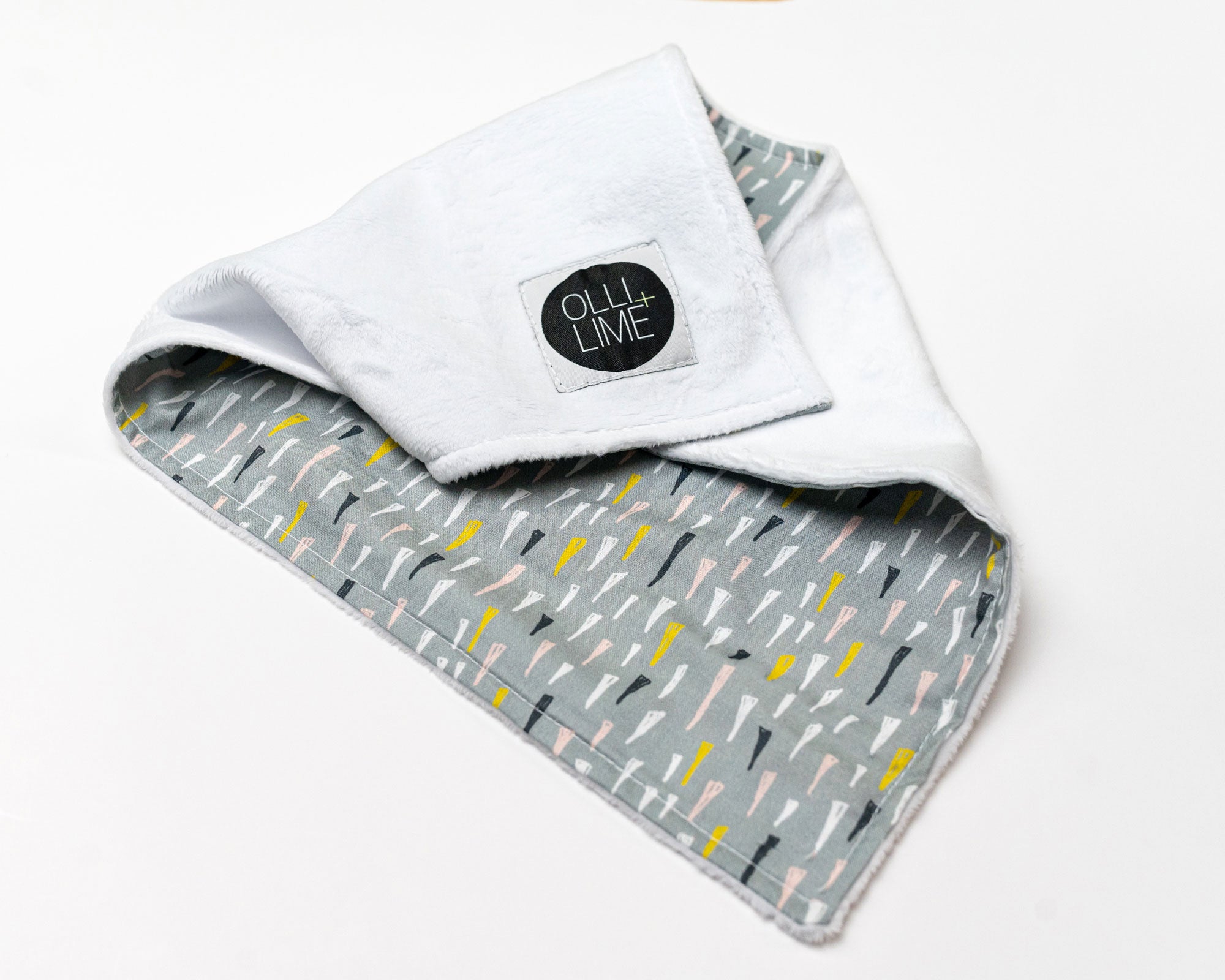 Jester's Hat Deluxe Crib Bedding Set featuring colorful jester hats on a sage background with a charcoal gray crib skirt.