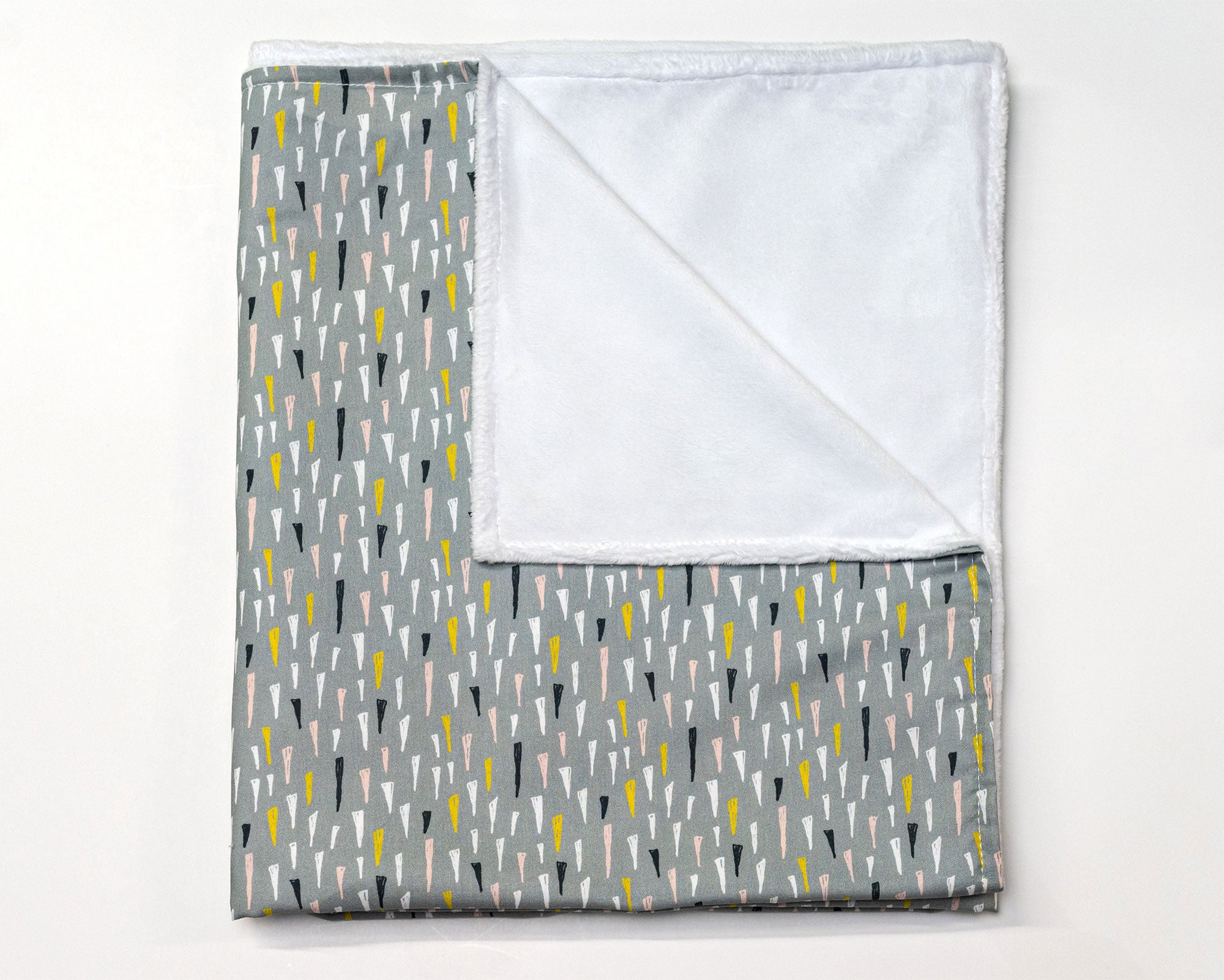 Jester's Hat Deluxe Crib Bedding Set featuring colorful jester hats on a sage background with a charcoal gray crib skirt.