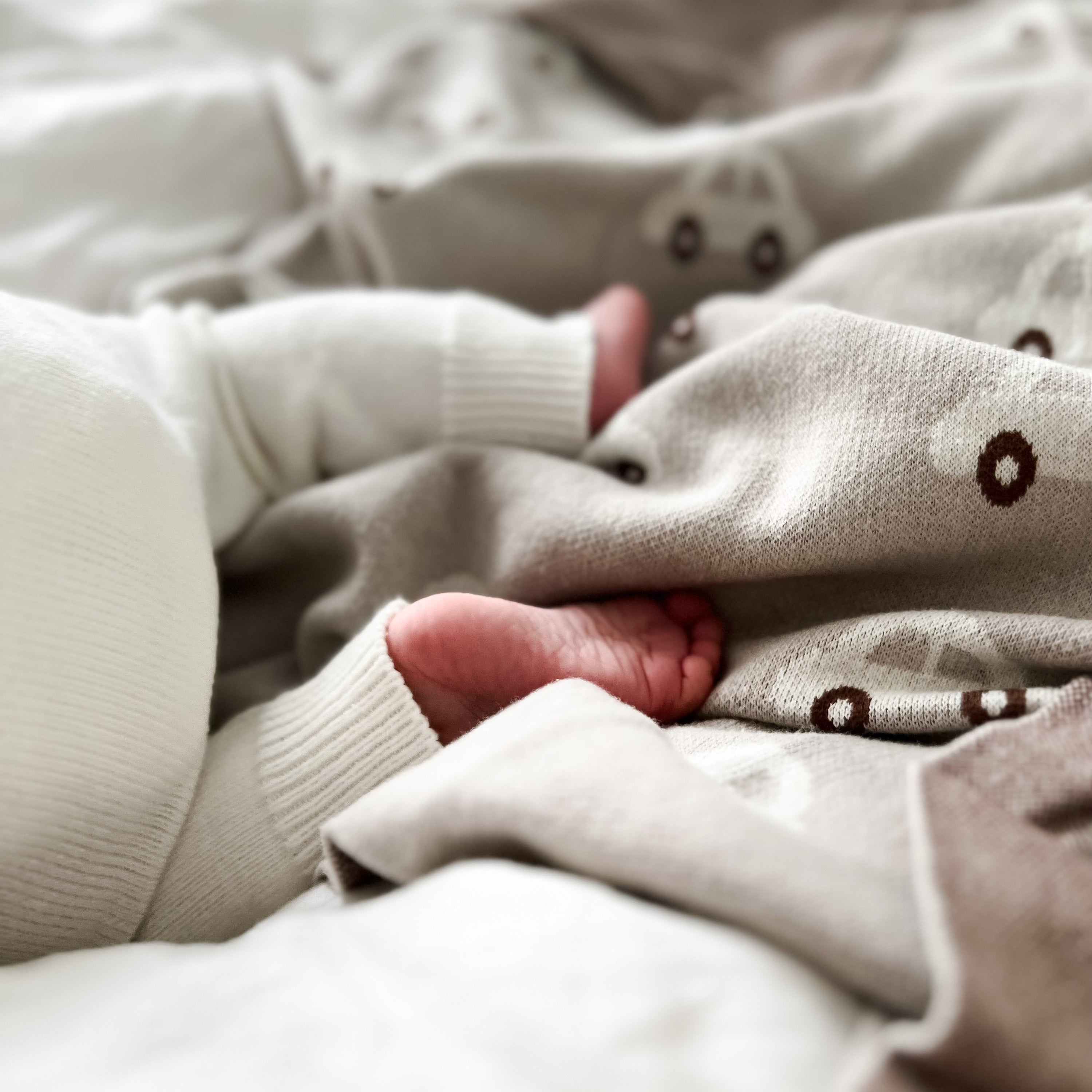 Knit Cars Blanket made of 100% cotton featuring a locomotive design, perfect for newborns and toddlers.