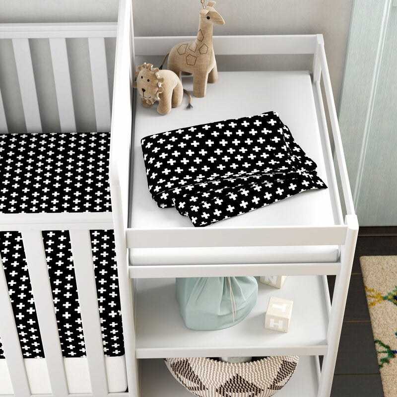 Lina Classic Crib Bedding Set featuring black and white swiss cross design with a fitted sheet, black cross blanket, and crib skirt.