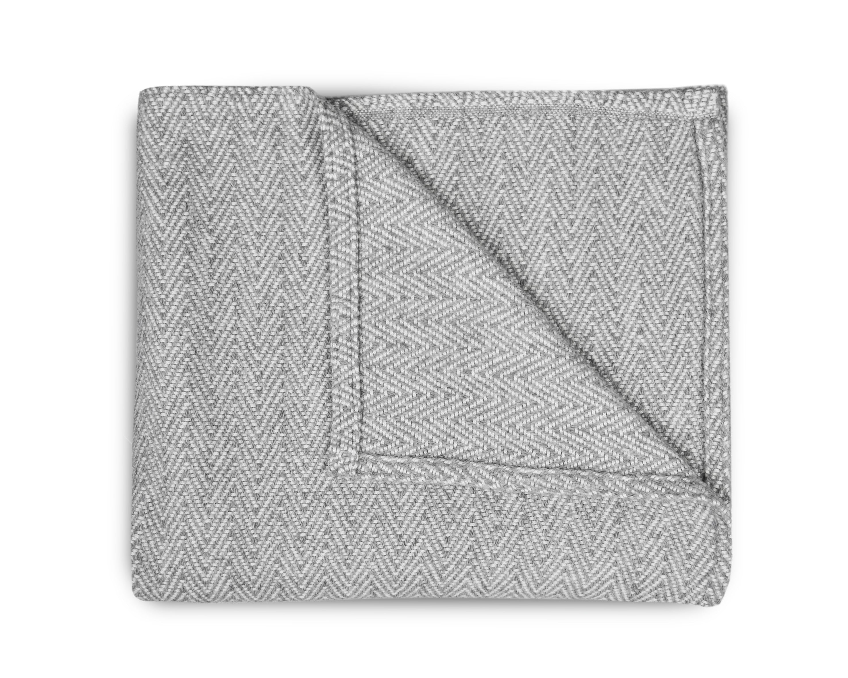 Lina Deluxe Crib Bedding Set featuring Swiss cross design in black and white with a grey weave blanket, perfect for modern nurseries.