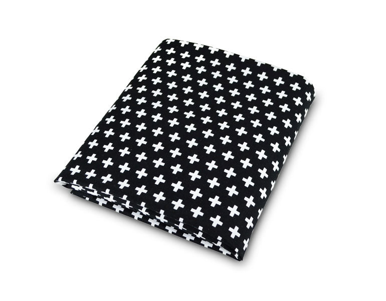 Lina Deluxe Crib Bedding Set featuring Swiss cross design in black and white with a grey weave blanket, perfect for modern nurseries.