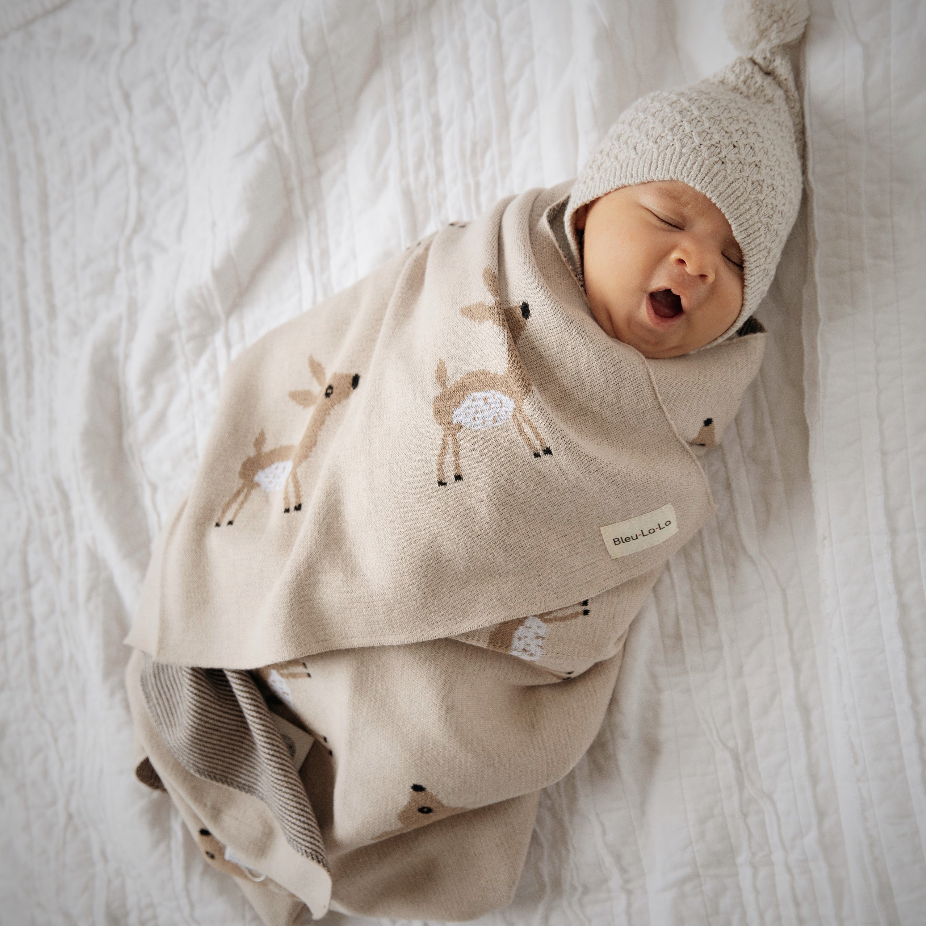Luxury Cotton Deer Knit Swaddle Baby Blanket featuring a soft, breathable design with a charming deer pattern, perfect for newborns and toddlers.