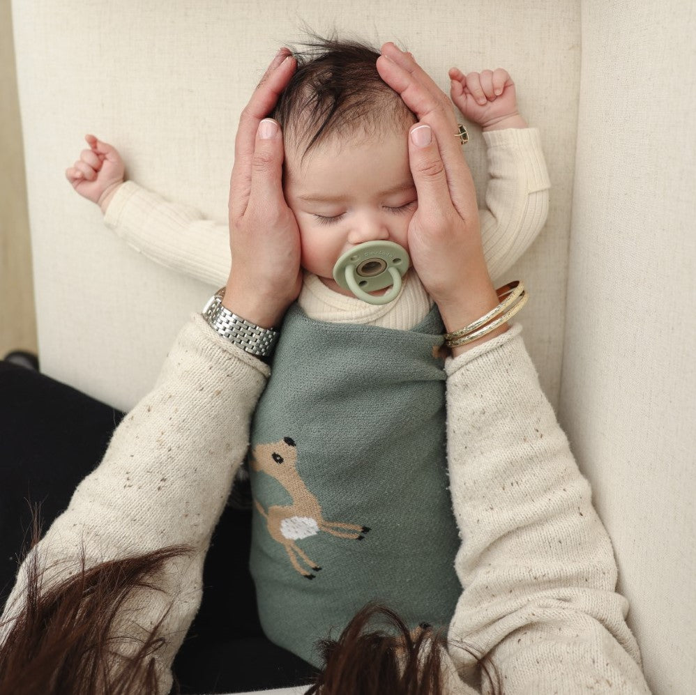 Luxury Cotton Deer Knit Swaddle Baby Blanket featuring a soft, breathable design with a charming deer pattern, perfect for newborns and toddlers.