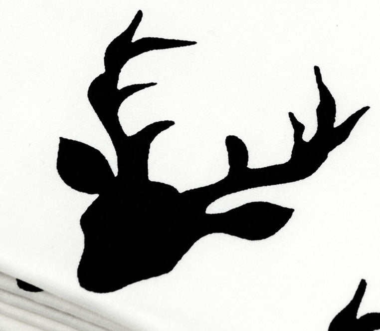 Mila Deluxe Crib Bedding Set featuring woodland deer design with grey weave blanket and charcoal crib skirt.